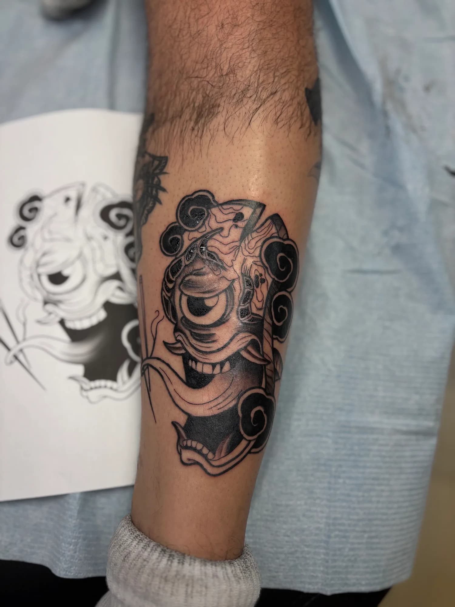 Black and grey Japanese Bakezori yokai shin tattoo by Kamy Cao.