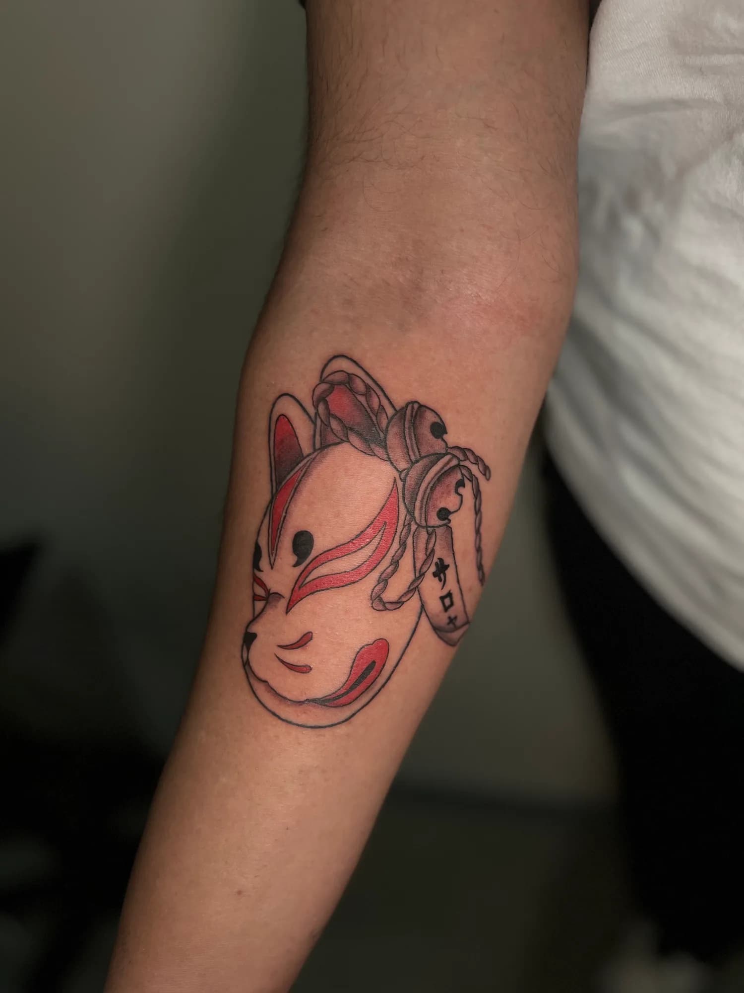 Black and grey new school Japanese Kitsune mask tattoo by Kamy Cao.