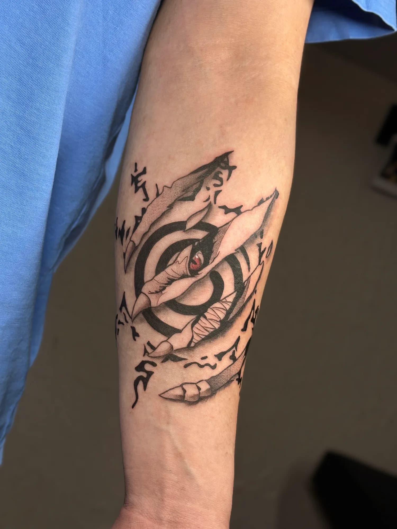 Black and grey anime Naruto Kurama forearm tattoo by Kamy Cao.